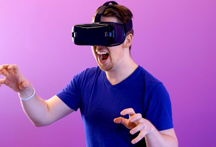 a man putting on a VR set and screaming